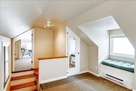 Upstairs sitting area with 2 closets and room