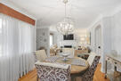 Large picture windows with drapers and shades