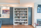 Bookcase rotates and turns into a wall bed