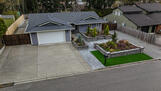 Immaculate curb appeal with ample driveway
