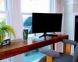 Desk with monitor, dock, mouse and keyboard
