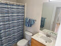 Brightly lit full bathroom