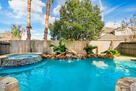 Pool with waterfall and hot tub