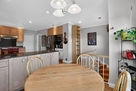 The breakfast nook borders the counter for ea