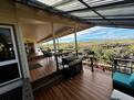 Lanai with gas grill and outdoor dining