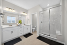 Owner's bath with dual vanity, water closet,