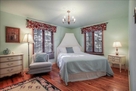 Bed 1-Queen bed, hardwood floors, and blinds.