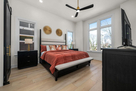 Primary bedroom with king bed & tons of natur