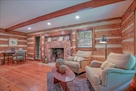 A comfortable seating area by the fire or a D