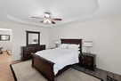 Queen bed in master bedroom.