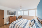 Chest of drawers and desk with view of Coit