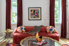 Red velvet seating adds bold glam to lounge