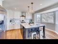 Kitchen Quartz Island, hardwood floors.
