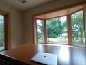 Office views toward lake and woodlands