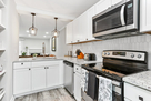 Kitchen with living room vies