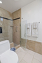 Mstr Bdrm bath, walking shower with pebble ro