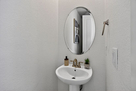 Main level half bath &mdash; simple and convenien