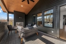 Relax on this covered patio w/gas fireplace &