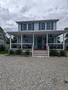 covered porch with furniture, perfect for a m