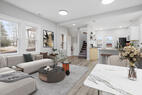 Open-concept furnished dining and kitchen