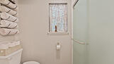 Toilet  and shower in master bath.