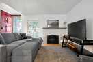 living room with wood burning fireplace