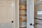 Walk in pantry with lots of shelves