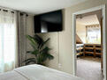 Master 55&rdquo; TV and closet entry