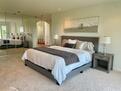 Wall to wall closets provide ample space