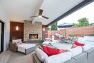 Covered Loggia with fireplace. Outdoor dining