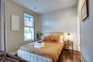 First-floor suite: kitchenette, bath, backyar