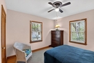 Back bedroom overlooks wooded hillside.