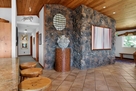 Rock siding throughout, defining Colorado sty