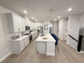 fully equipped kitchen with new appliances.