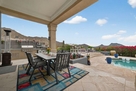 Covered dining by outdoor kitchen