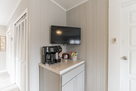 Coffee bar/storage cabinet and 33" mounted TV