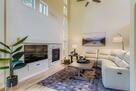 Great Room with Fireplace and Soaring Ceiling
