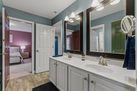 His and Hers bathroom connecting green room a