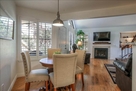 Dining table with view of TV and Gas Fireplac