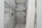 Clean and updated walk in shower in master ba