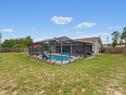 Backyard View of Screened Pool Enclosure