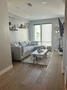 Living area with automatic shades.