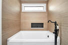 Relax in the primary ensuite bathroom tub