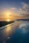 infinity pool with a view of Puget Sound suns