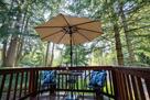 Second story deck surrounded by mature trees