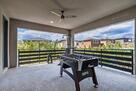Covered balcony with foosball table, gym