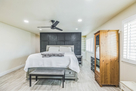 Primary bedroom with custom feature wall