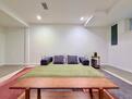 Couch in basement converts to full king sized