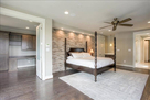 Brick accent wall in master bedroom