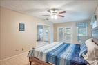 Master bedroom w/access to balcony